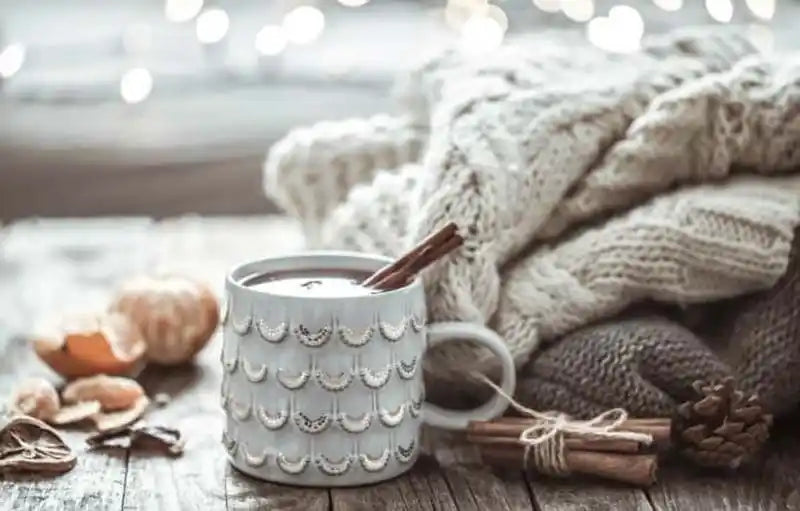 Beautiful chunky blanket with a steamy mug of hot chocolate. 